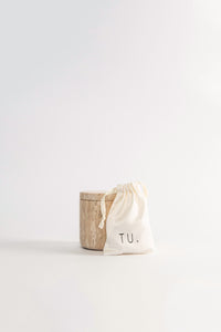 A travertine box with soy wax beads